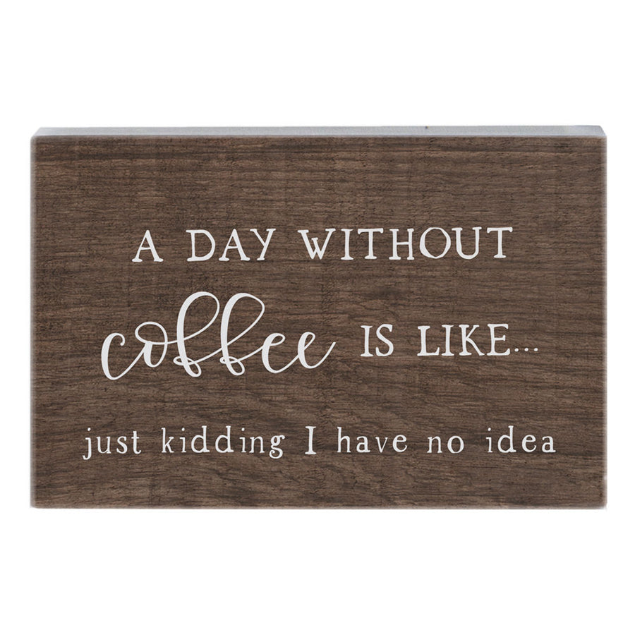 SincereSurroundings presents the "Day Without Coffee" handcrafted wooden sign, featuring a humorous white text that says, "A day without coffee is like... just kidding, I have no idea." Perfect for effortless display, this delightful piece adds a touch of humor to any Rock Rapids home.