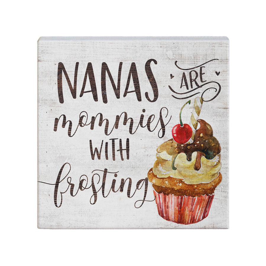 A handcrafted sign titled "Nanas Frosting" by SincereSurroundings features the text "Nanas are mommies with frosting," positioned beside an illustration of a cupcake adorned with swirled frosting, chocolate syrup, a cherry, and a wafer stick. It's ideal for enhancing your shelf display in Rock Rapids!