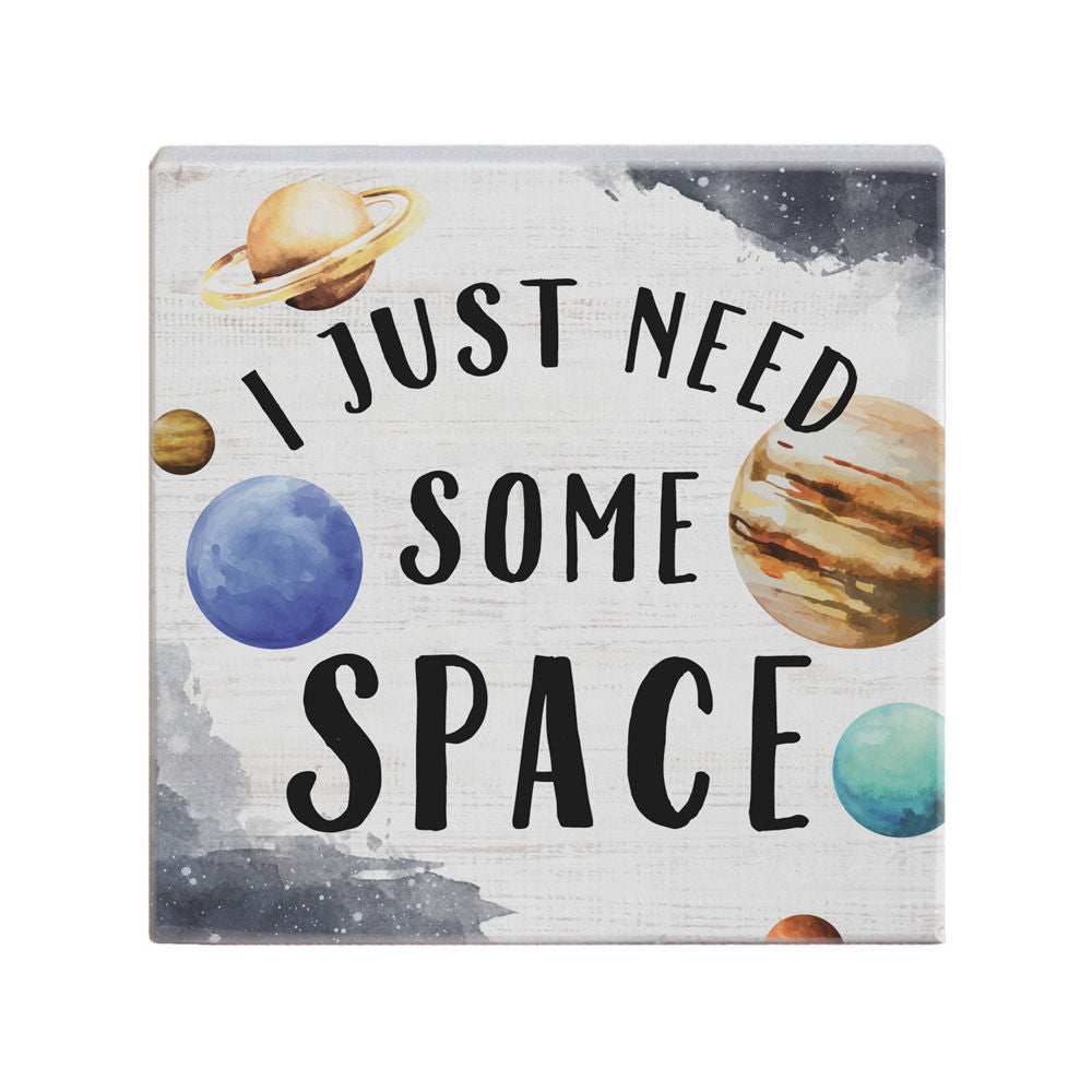 The Need Space, a square handcrafted artwork by SincereSurroundings, features a space theme adorned with illustrations of planets, including Saturn and Jupiter. The bold text "I JUST NEED SOME SPACE" is elegantly arranged around the planets against a watercolor background. This piece is perfect for your display shelf or as a unique addition from Rock Rapids IA.