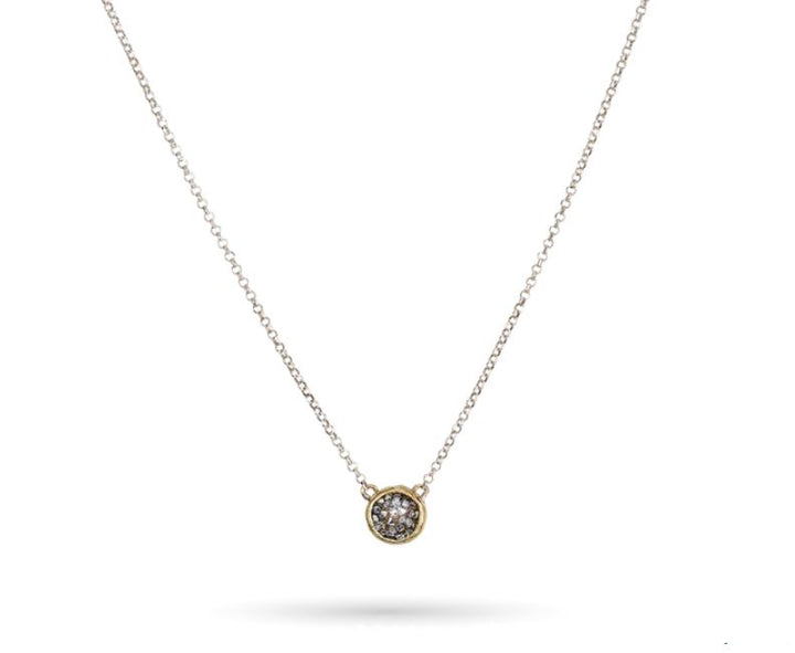 The Kristal Dome Necklace 18in by Waxing Poetic features an intricate design with a slender gold chain and a central circular pendant adorned with a shimmering gemstone. Displayed against a simple white background, this stunning piece enhances any outfit with its sophisticated charm.