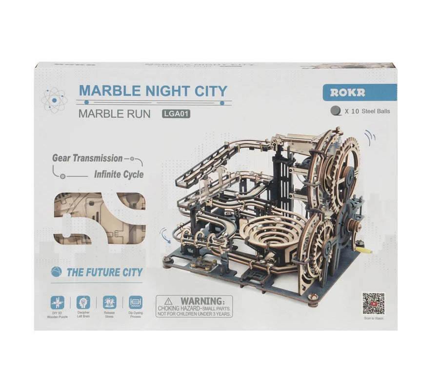 Box of a mechanical model kit labeled "DIY Marble Run Night City" by Hands Craft. This Wooden Puzzle is a 3D Marble Run featuring gears, ramps, and loops designed for marbles. Warnings about small parts are present, including a hazard warning for children under 3 years. Perfect for DIY Assembly enthusiasts.