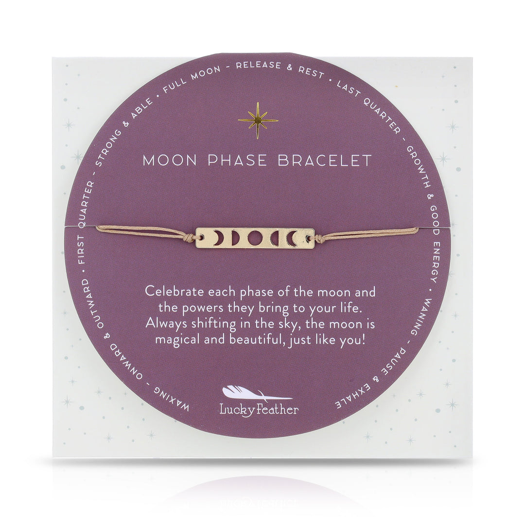 A card showcases the Moon Phase Bracelet Gold by LuckyFeather, adorned with symbols representing different moon phases on a 14k Gold-dipped strip. The card reads: "Moon Phase Bracelet. Celebrate each phase of the moon and the powers they bring to your life. Always shifting in the sky, the moon is magical and beautiful, just like you! Perfect for astrological enthusiasts.