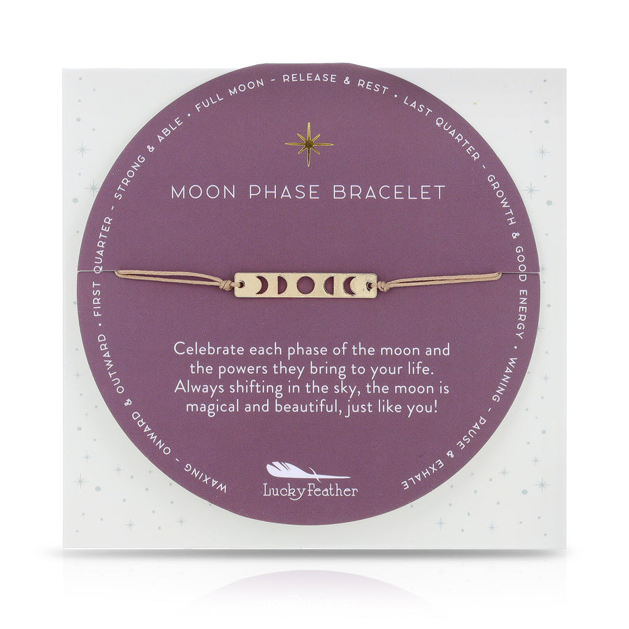 A card showcases the Moon Phase Bracelet Gold by LuckyFeather, adorned with symbols representing different moon phases on a 14k Gold-dipped strip. The card reads: "Moon Phase Bracelet. Celebrate each phase of the moon and the powers they bring to your life. Always shifting in the sky, the moon is magical and beautiful, just like you! Perfect for astrological enthusiasts.