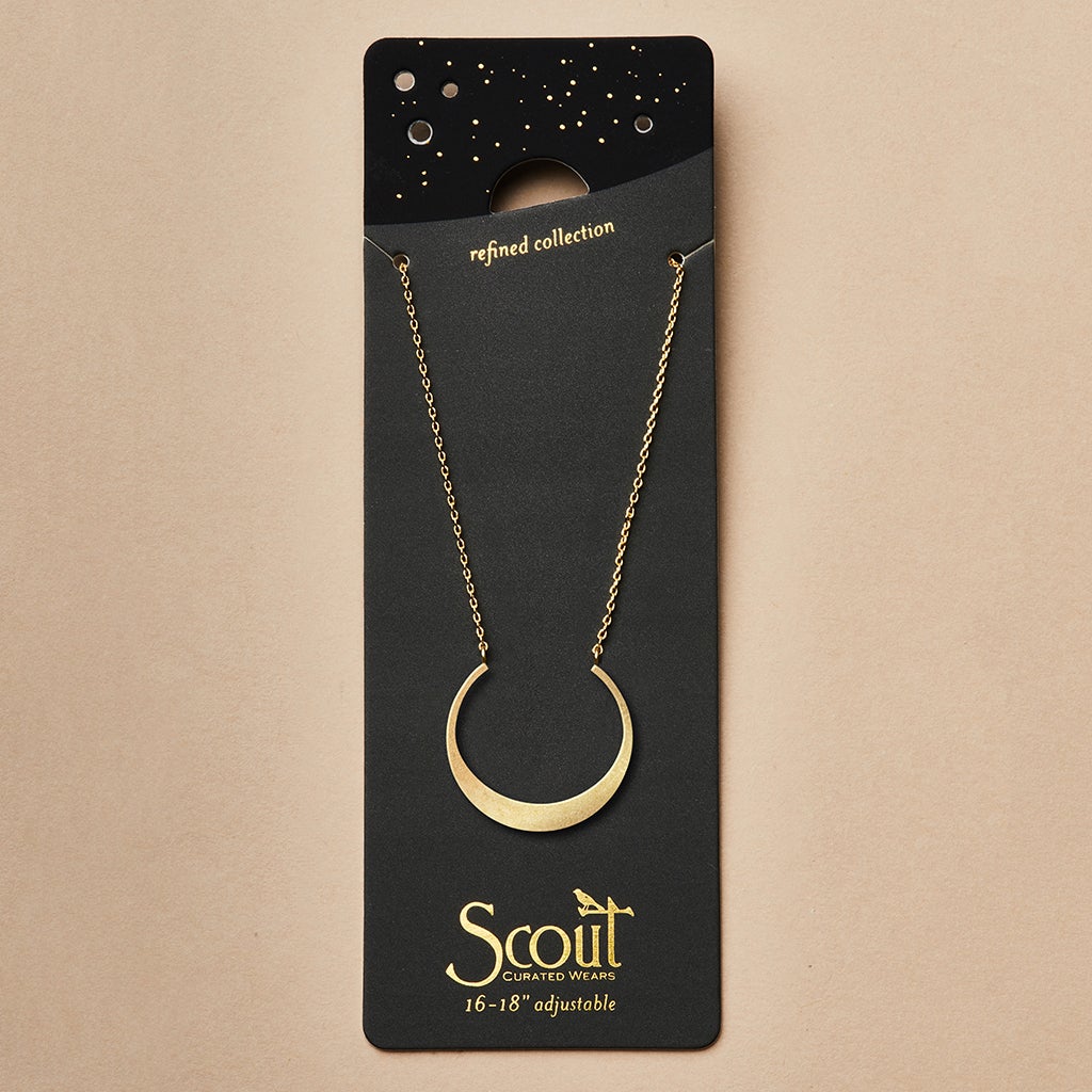 The "Refined Neck Crescent/Gold" necklace by Scout Jewelry, crafted in 18k gold vermeil, is elegantly presented on a dark card featuring a starry sky design. The card is inscribed with "refined collection" and "Scout Curated Wears," showcasing its adjustable chain measuring 16-18''.