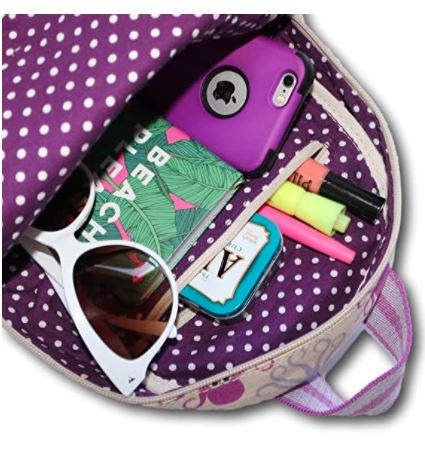 An open Backpack Octopus from Bungalow 360 displaying its contents: a purple phone case, a beach-themed notebook, white sunglasses, a small mint tin, and several colorful highlighters. This vegan Backpack Octopus boasts unique designs in pink and purple with a polka dot inside lining.