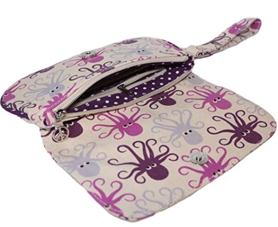 Introducing the "Large Wristlet Octopus" by Bungalow 360: a spacious, fabric pouch crafted from durable natural cotton canvas, featuring a snap-close flap adorned with charming purple, pink, and gray octopus patterns. Its interior lining showcases white polka dots against a purple backdrop. This unique wristlet design comes complete with an attached wrist strap for added convenience.