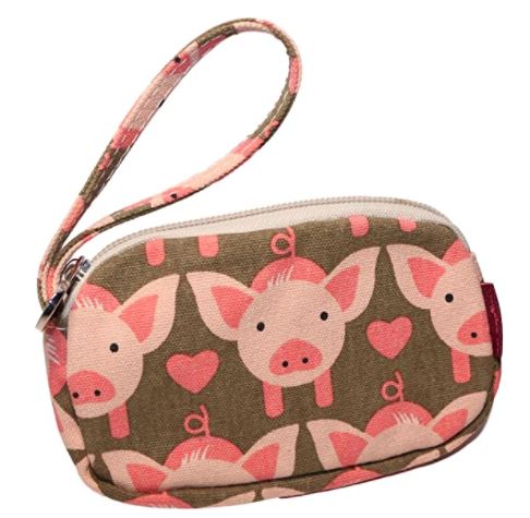 The Bungalow 360 Tiny Wristlet Pig is a small wristlet bag featuring a pattern of pink pig faces and hearts on a green background, complete with a zipper and strap. Its cute and playful design is perfect for those supporting animal causes, and it's uniquely vegan-friendly.