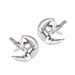 The Moon and Star Silver Stud earrings by Welman, crafted from sterling silver with star-shaped cutouts, are elegantly showcased against a white background.