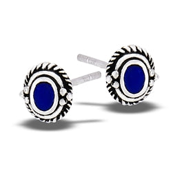 The Oval Lapis Braided Granulation Silver Stud earrings by Welman feature a striking oval lapis stone at the center, elegantly bordered by detailed black and silver accents. These mask-friendly earrings enhance your facial features, bringing a sophisticated edge to any outfit.