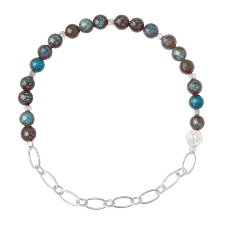 The Chain Bracelet Blue Sky Jasper/Silver by Scout Jewelry combines marbled blue and brown semi-precious gemstones with a linked paperclip chain, seamlessly merging with a silver clasp.