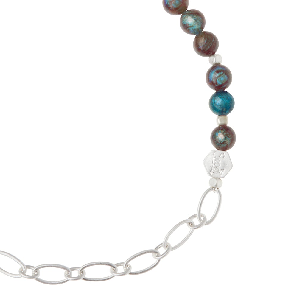 The Chain Bracelet Blue Sky Jasper/Silver by Scout Jewelry blends turquoise and brown marbled stone beads with a silver paperclip chain, joined by a small hexagonal silver bead.