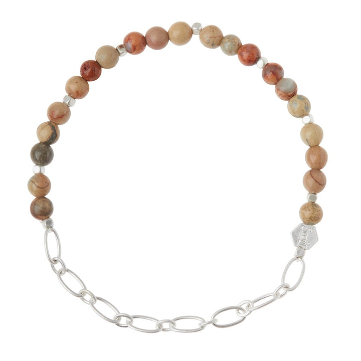 The Chain Bracelet Aqua Terra/Silver by Scout Jewelry showcases an elegant combination of round, earth-toned semi-precious gemstone beads in shades of brown, red, and gray alongside a silver paperclip chain. It is enhanced with an engraved logo bead and fastens gracefully with a silver clasp.