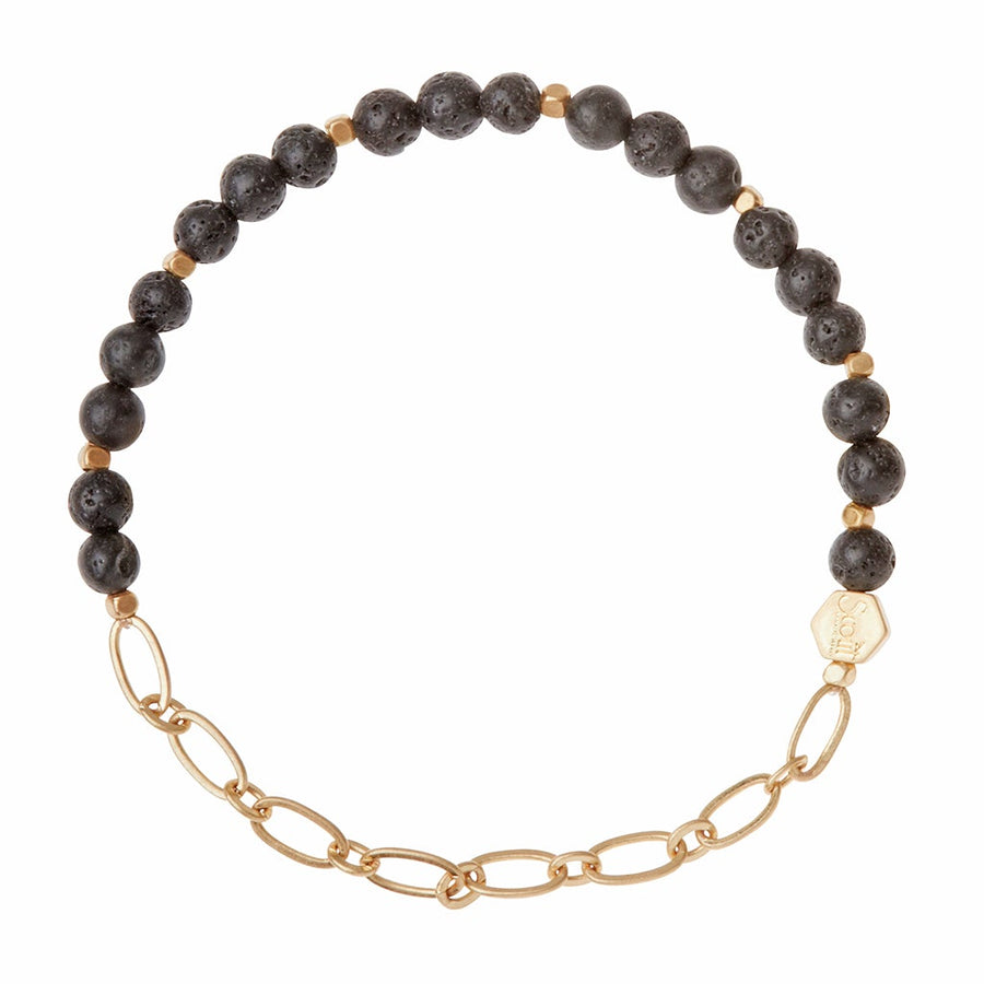 Introducing the Chain Bracelet Lava/Gold from Scout Jewelry, crafted with black lava rock beads and small gold spacer beads linked to a section of paperclip chain. It also features a delicate hexagonal gold tag for an elegant touch.