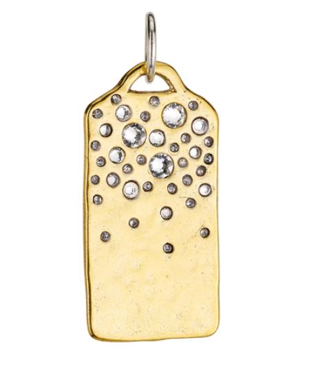 The Starshower Infinity Ingot Pendant by Waxing Poetic is a brass rectangle with a silver loop, elegantly adorned with clear crystals of varying sizes, artistically arranged at the top for a brilliant and sparkling effect similar to the Starshower Omega Ring.