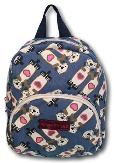 A blue Backpack Sea Otter made from vegan cotton canvas showcases a whimsical design of white and black dogs in scarves with pink heart patches. Featuring a unique style, it includes a front pocket and top handle, with the brand name "Bungalow 360" prominently displayed on the front pocket.