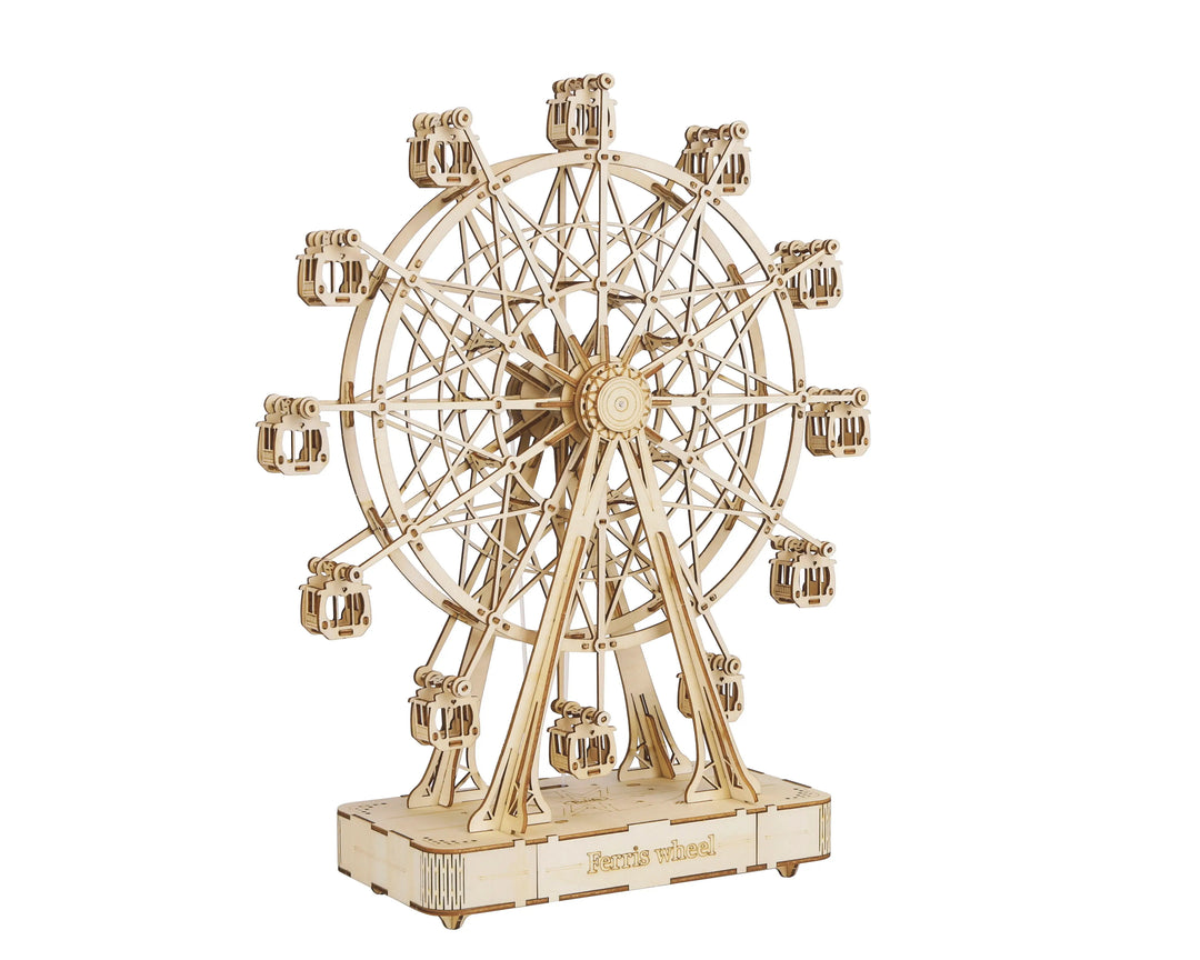 The DIY Ferris Wheel by Hands Craft is a small, intricately designed wooden model made from laser-cut plywood. It features multiple gondolas and showcases detailed construction elements. The words "Ferris Wheel" are engraved on the base, and the model stands on a rectangular platform displaying a natural wood finish.