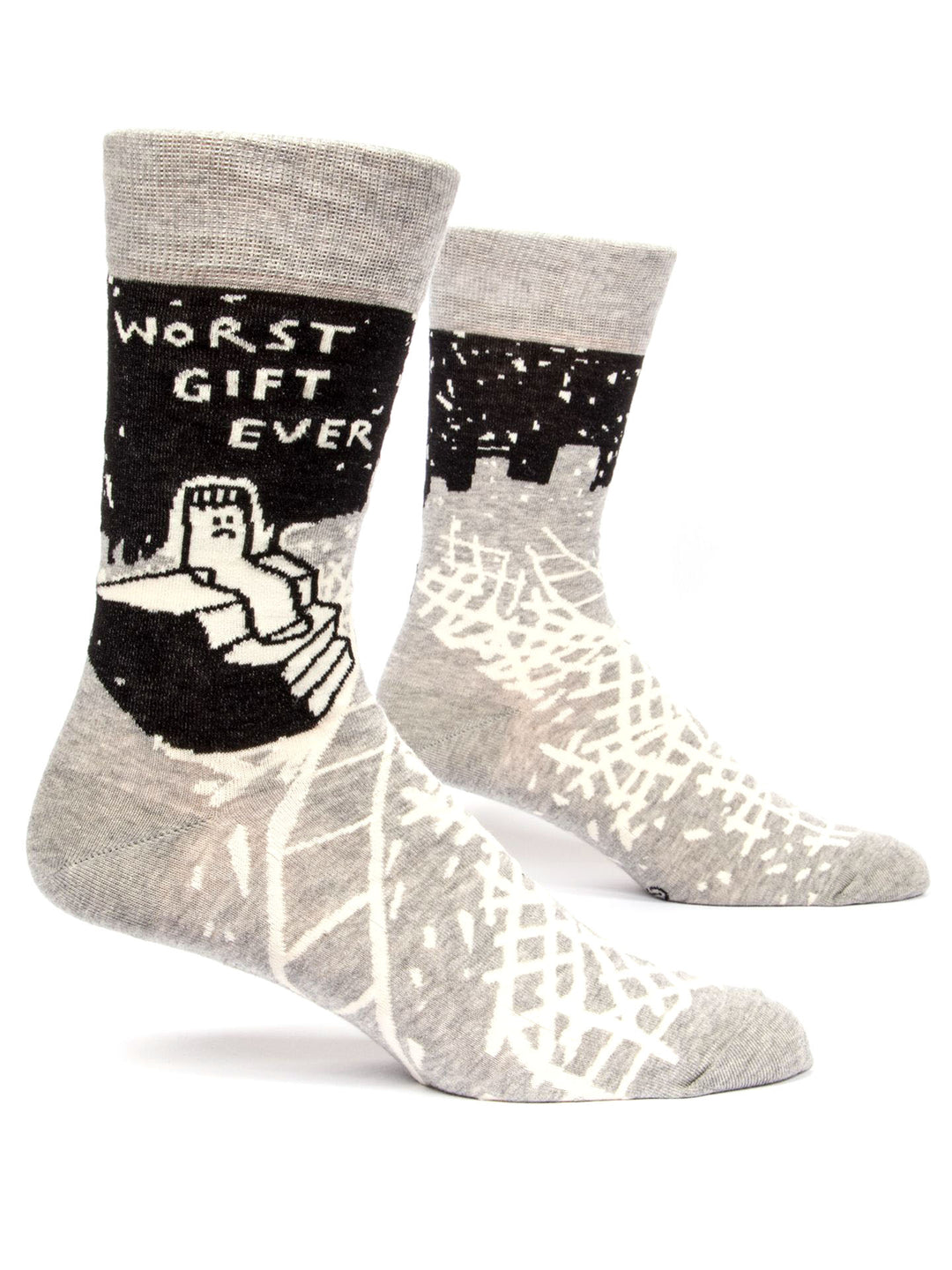 Introducing the Worst Gift Ever Socks by Blue Q—a pair of men’s gray socks featuring striking black and white designs. One sock boldly states "WORST GIFT EVER" above an eye-catching illustration of a wrapped gift box, complemented by abstract shapes and patterns that adorn both combed cotton socks.