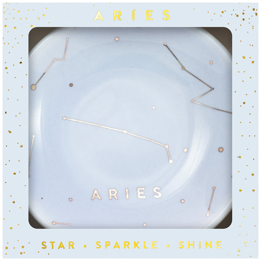 The LuckyFeather Dish Aries is a decorative trinket dish that showcases the Aries constellation in gold on a light blue background. The packaging, which doubles as an ideal gift box, features a gold-speckled design with "ARIES" at the top and "STAR · SPARKLE · SHINE" at the bottom.