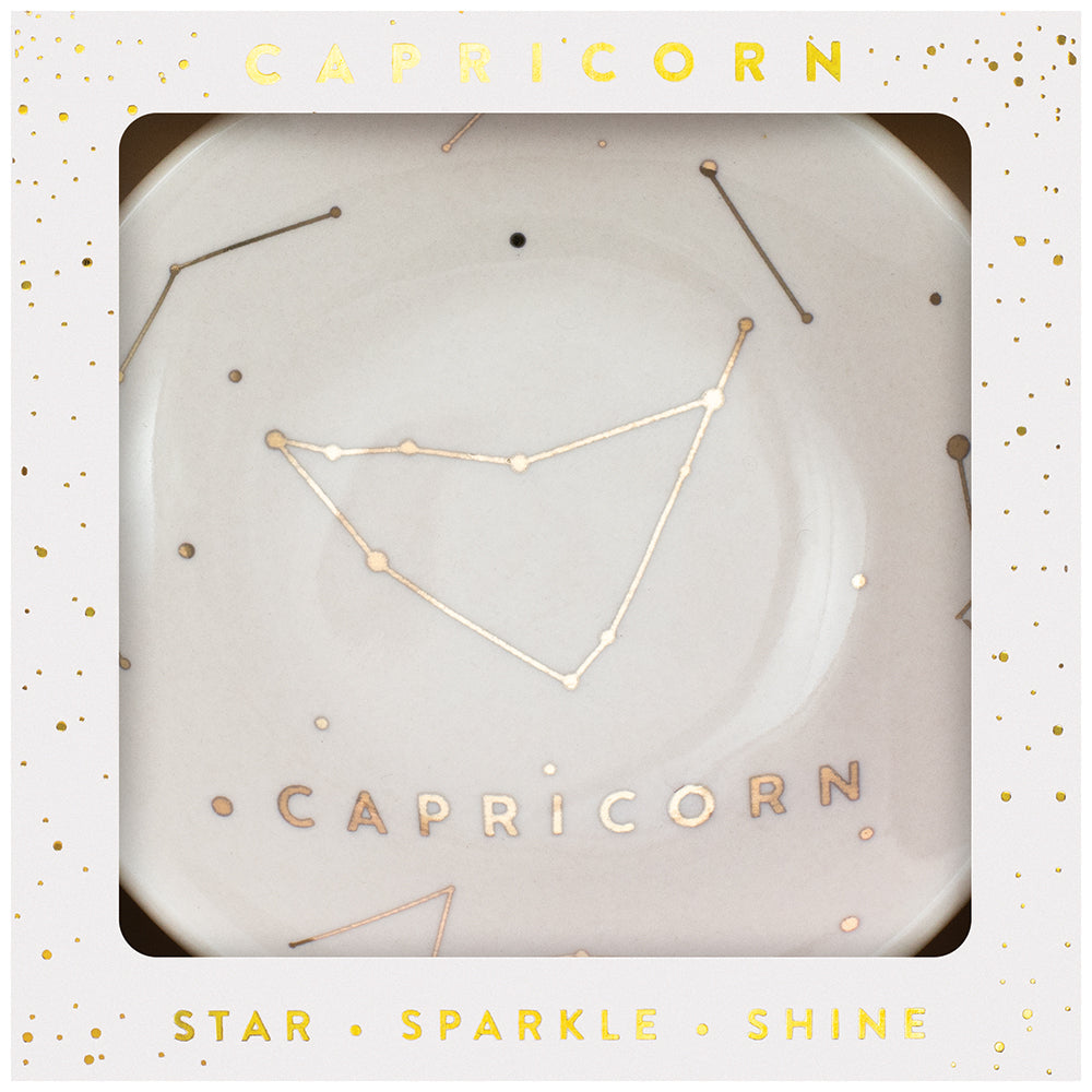 Presenting the Dish Capricorn by LuckyFeather, this white trinket dish features a stunning gold Capricorn constellation design and "Capricorn" beautifully scripted in gold. It comes packaged in an elegant gift box decorated with gold stars and the words "Star Sparkle Shine," making it an ideal choice for use as a jewelry holder or a celestial keepsake.