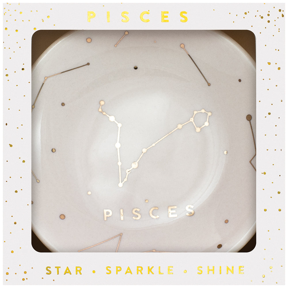 LuckyFeather's Dish Pisces is a white ceramic trinket dish with a central gold Pisces constellation design, accented by small stars. Ideal for holding jewelry, it comes packaged in an elegant gift box featuring the words "Pisces," "Star," "Sparkle," and "Shine" printed beautifully in gold.