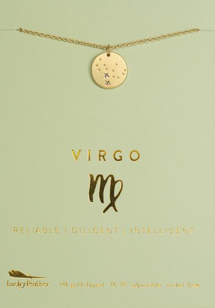 A gold Zodiac Necklace Virgo with a circular pendant is displayed against a light green background. The card reads "VIRGO" with the Virgo symbol and the words "RELIABLE | DILIGENT | INTELLIGENT" in gold text. At the bottom, it mentions 14k gold dipped and the brand "LuckyFeather.