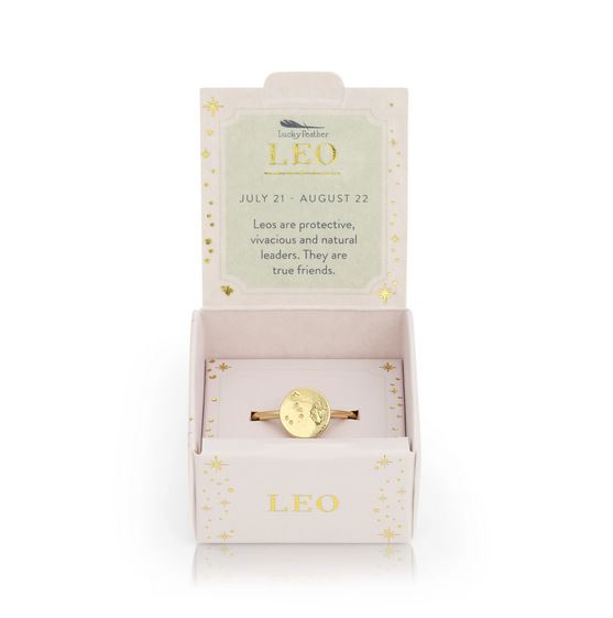 Introducing the Leo Signet Ring by LuckyFeather, featuring a 14k gold-dipped disk with the symbol of Leo. Beautifully presented in an open box, the packaging honors Leo's traits: protective, vivacious, and natural leaders. The dates July 21 - August 22 elegantly adorn the adjustable band.