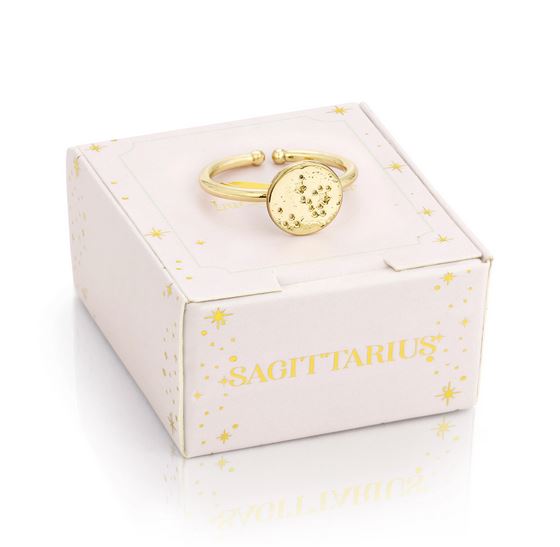 The LuckyFeather Sagittarius Signet Ring, crafted with a 14k gold-dipped finish and featuring the Sagittarius constellation, gracefully sits atop a white box decorated with "Sagittarius" and star patterns. Its adjustable band guarantees an ideal fit for any astrology lover.