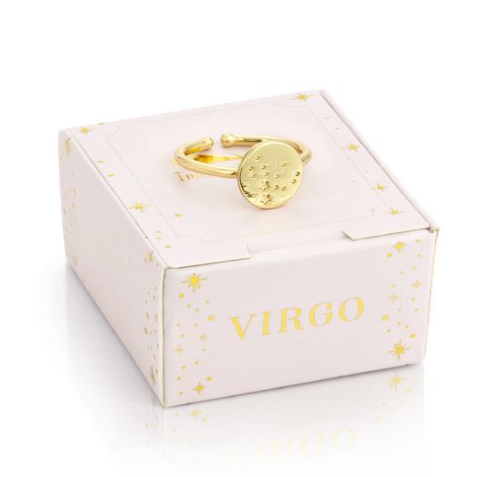 A Virgo Signet Ring by LuckyFeather, dipped in 14k gold and featuring a Virgo constellation design, rests on a white box labeled "Virgo" and embellished with star patterns.