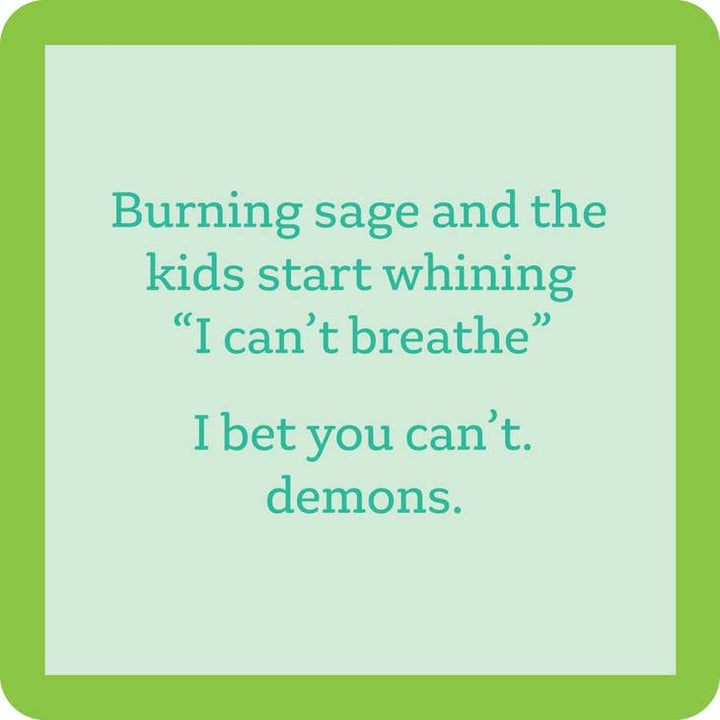 The "Burning Sage Coaster" by Drinks On Me features a light green background with a humorous teal text message, bordered by a darker green frame. The message reads, "Burning sage and the kids start whining 'I can't breathe.' I bet you can't. demons." It's perfect for use with resin finishes or cork backing.