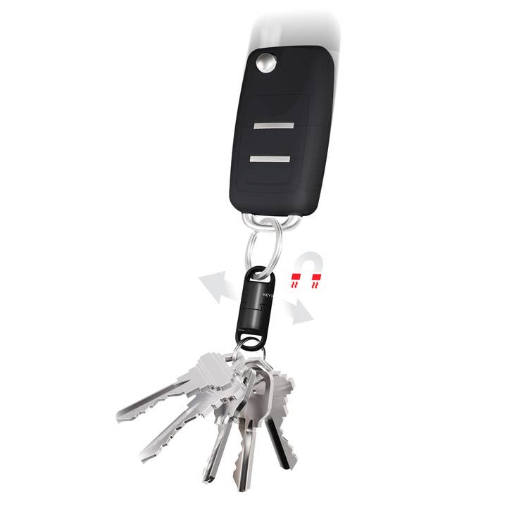 The Magnetic Quick Connect Pro by KeySmart is a stylish black key fob attached to a key ring with several silver keys. Its ultra-durable magnetic clasp, adorned with arrows and a magnet symbol, provides secure connectivity, making this sophisticated keychain both practical and elegant.