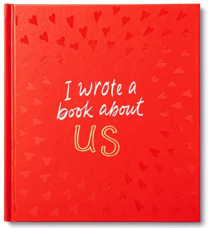 The book cover, featuring a charming red design adorned with small hearts, displays the title "I Wrote a Book About Us" in white and yellow script. Published by Compendium, this fill-in book is perfect for capturing sweet moments and transforming them into your very own love story.