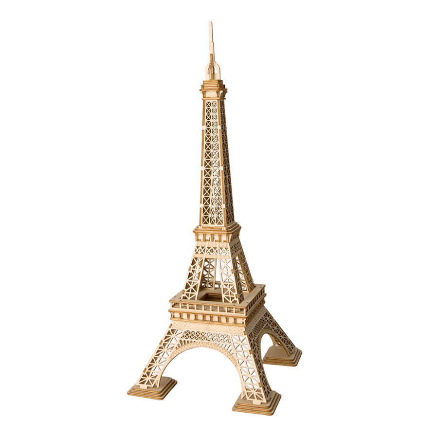 The 3D Wooden Puzzle: Eiffel Tower by Hands Craft is displayed against a white background. The intricate detailing, achieved through laser-cut techniques, replicates the lattice structure of the iconic Parisian landmark, with a pyramidal shape tapering to a point at the top.