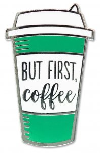 The First Coffee Pin by PeterPauperP is a charming accessory that captures your caffeine ritual, featuring a green and white coffee cup design adorned with the black text "But First, Coffee." Crafted as a hard enamel pin, it's perfect for any coffee enthusiast.