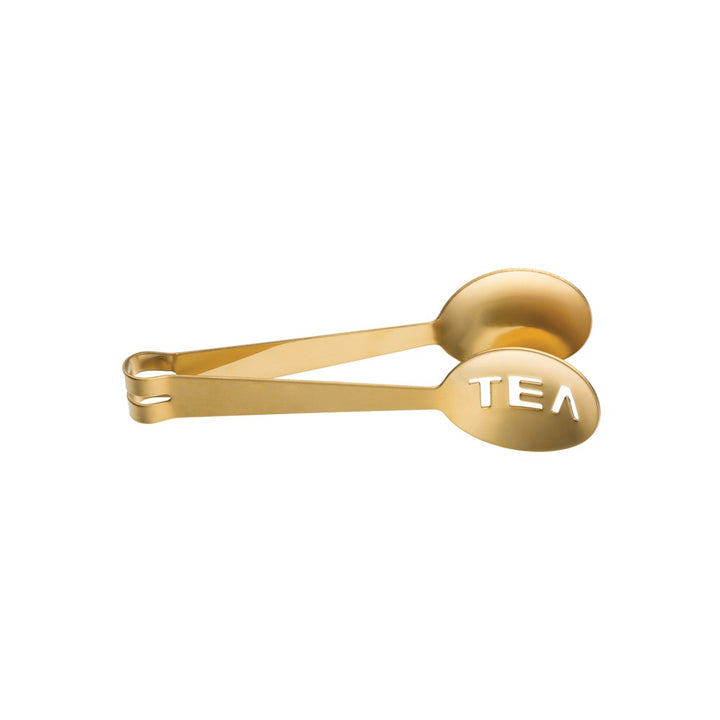 The CreativeCoOp Stainless Steel Tea Tongs Gold, featuring a gold finish and the word "TEA" cut out on one end, is perfect for tea enthusiasts. It elegantly combines the functions of measuring tea leaves and sealing bags.