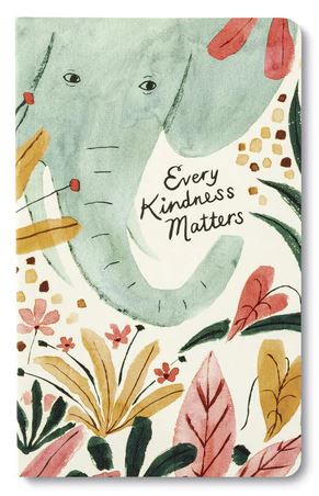 The journal, "Every Kindness Matters" by Compendium, features a whimsical illustration of an elephant surrounded by colorful leaves and flowers on its cover. The phrase is elegantly written in calligraphy beside the elephant, completing this soft, watercolor artwork.