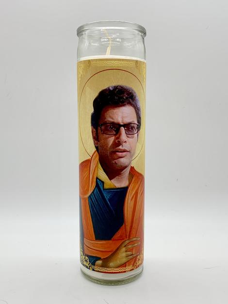 The Jeff Goldblum Candle by BOBBYK BOUTIQUE showcases the actor in religious iconography with glasses, robes, and a halo. This unscented candle adds a celebrity shrine vibe and charm to any space.