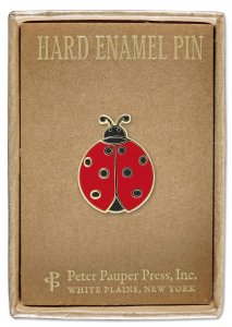 A beautiful hard enamel pin in the shape of a red and black ladybug is elegantly presented inside a charming gift box. The box features "Hard Enamel Pin" as the top label and details "PeterPauperP, White Plains, New York" at the bottom, perfectly sized to showcase this delightful Ladybug Pin.