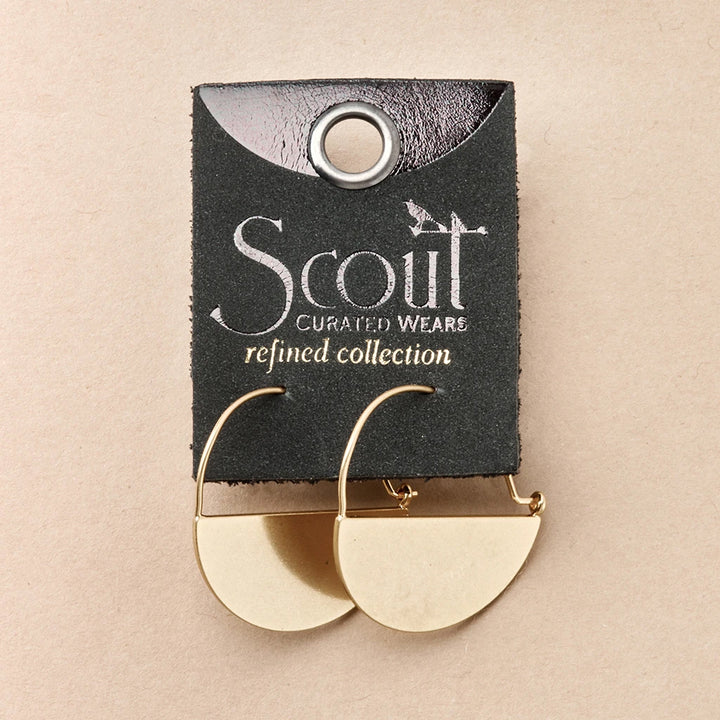 Lunar Hoop Gold earrings displayed on a black paper card with a round silver grommet. The card showcases the brand name "Scout Jewelry" and the text "Lightweight Refined Earring Collection." The background is a neutral beige surface.