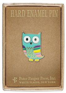 A colorful Owl Pin from PeterPauperP, featuring a vibrant owl design with blue, pink, and yellow details, measures 2-3/8 inches. It is beautifully presented on a brown card inside a chic gift box. The card is labeled "Hard Enamel Pin" and credits "Peter Pauper Press, Inc., White Plains, New York.