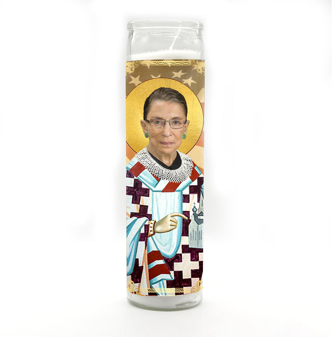 The Ruth Bader Ginsburg Candle by BOBBYK BOUTIQUE features a depiction of the justice in saint-like robes with a halo against a white background, giving it a celebrity shrine vibe.