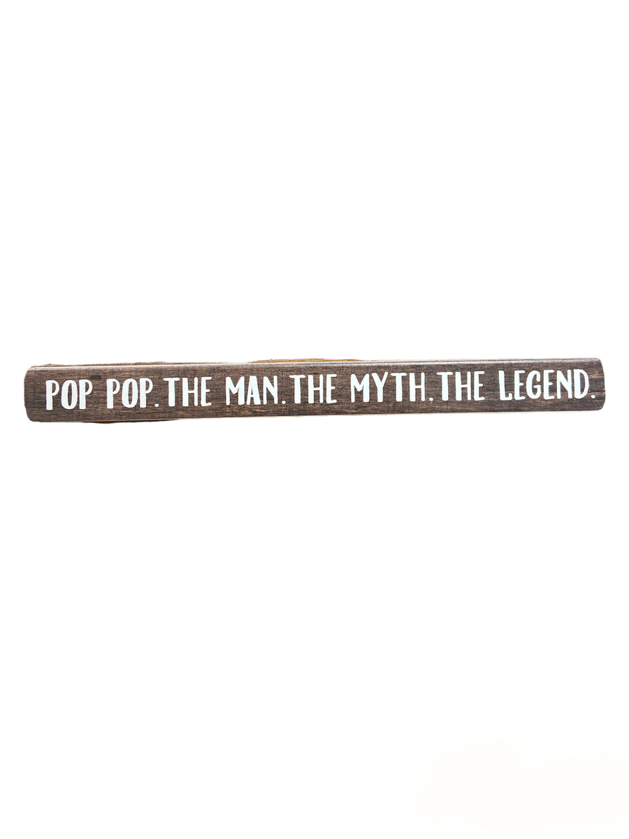 The "Pop Pop The Legend" sign by SincereSurroundings is a long wooden piece featuring white text that reads, "POP POP. THE MAN. THE MYTH. THE LEGEND." on a plain, light-colored background, perfectly capturing the unique essence of Pop Pop.